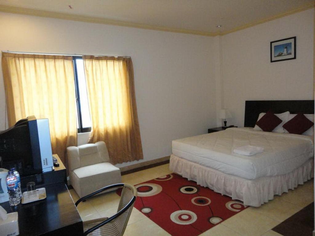 Grand Duta Hotel Palu Zimmer foto